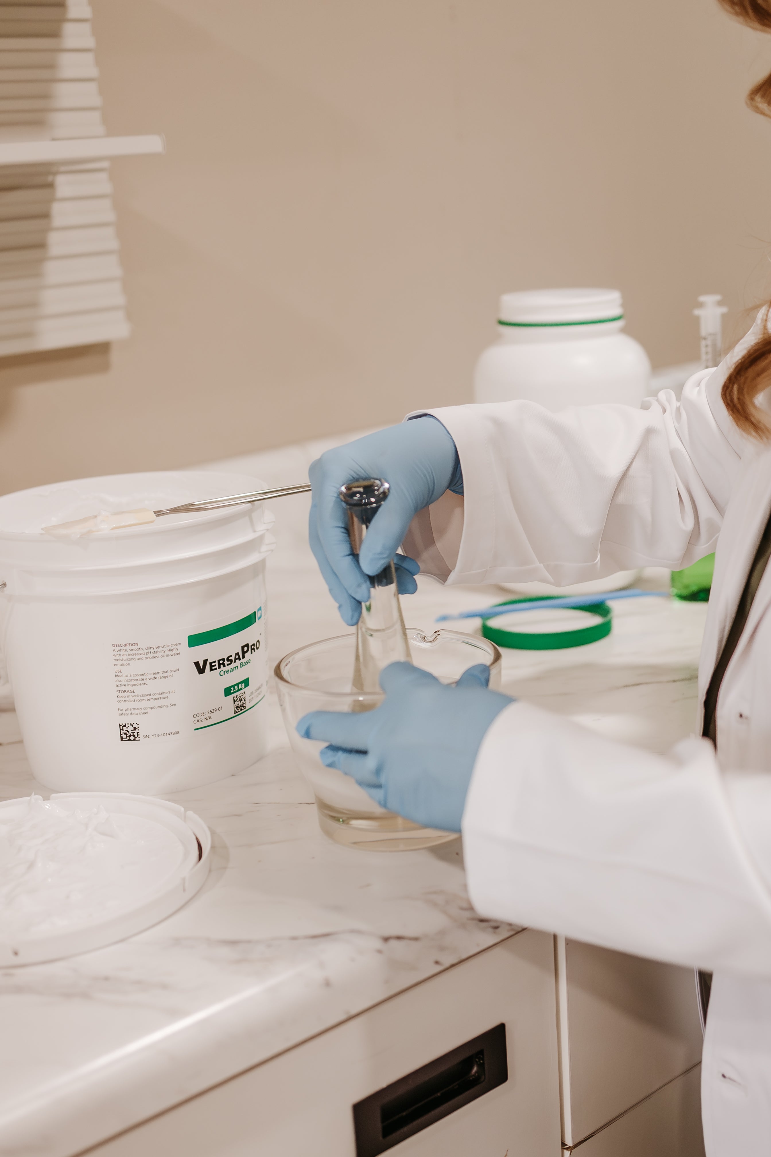 Staff member doing compounding