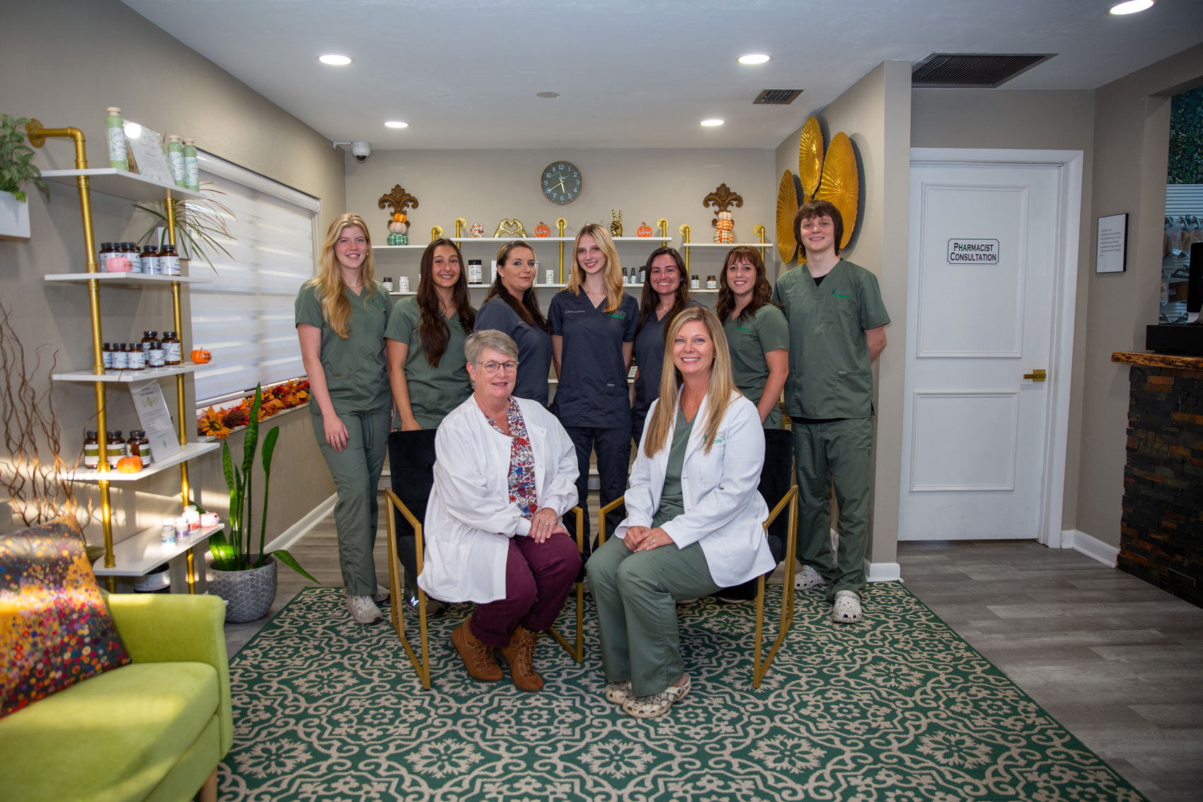 Group staff photo in the entrance way of building